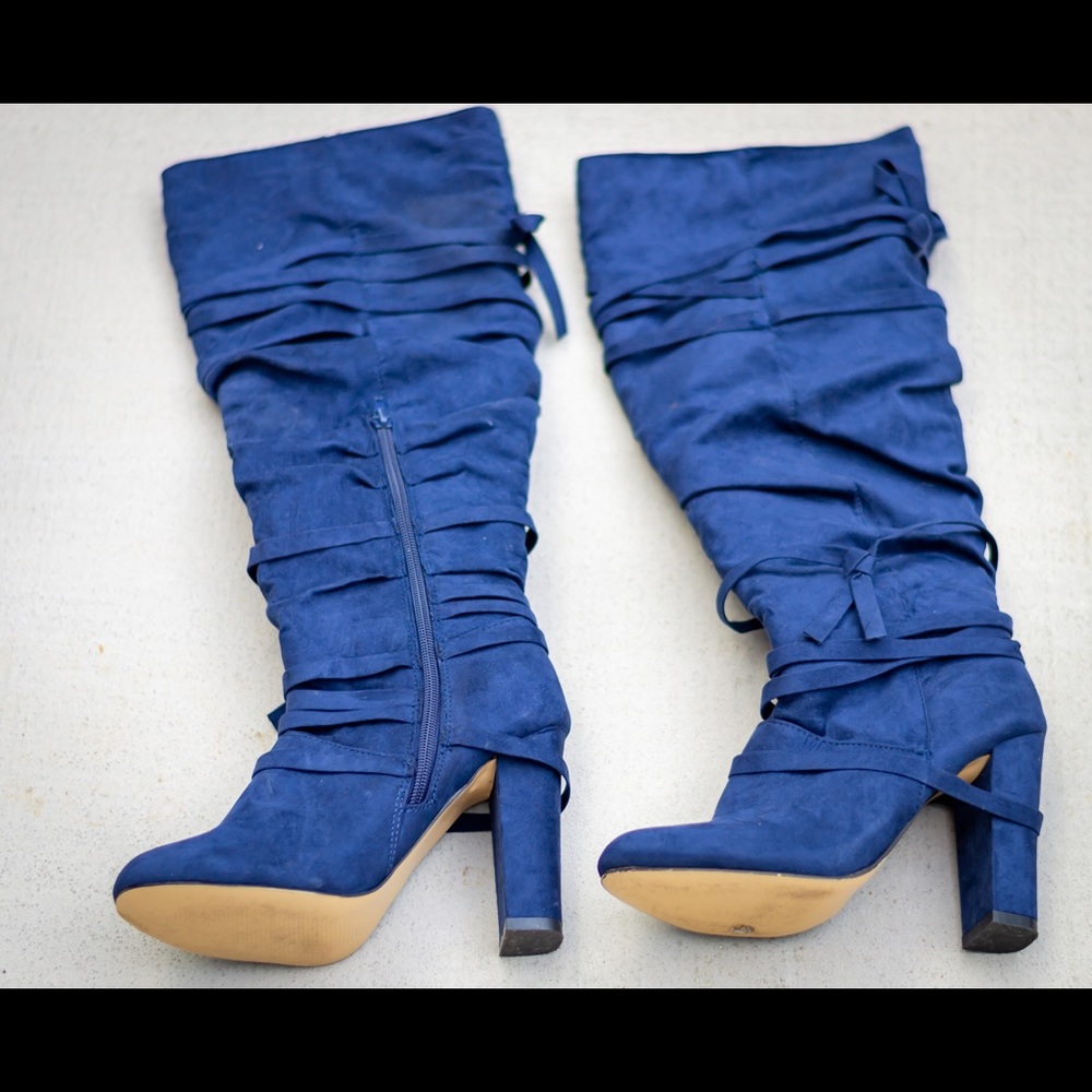 Dark blue heeled boots. New in box and never worn